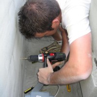 Photo Thumbnail #4: Drilling the hole for the electrical outlet for...