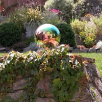 Photo Thumbnail #12: A gazing ball on top of an old outdoor...