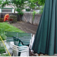 Photo Thumbnail #1: Nothing like a raining day to lay some sod.....