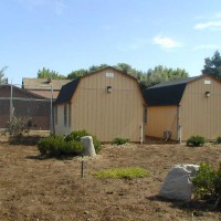 Photo Thumbnail #9: View of barns. The entire area is covered by a...