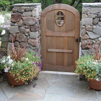 Photo Thumbnail #3: Stone pillars flank entry gate.