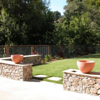 Photo Thumbnail #13: Cast concrete urns are twin water feature....