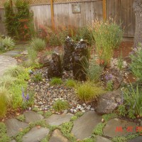 Photo Thumbnail #13: Pondless water feature consists of cored stone...