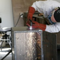 Photo Thumbnail #9: Plasma cutting the smoke hole.