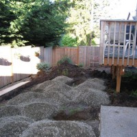 Photo Thumbnail #1: Removed tiny strip of grass, brought in gravel...