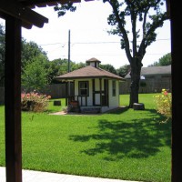 Photo Thumbnail #3: Playhouse and backyard from patio