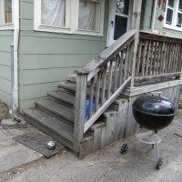 Photo Thumbnail #1: Side patio leading to backyard and garage
