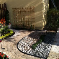 Photo Thumbnail #7: Sealed pavers, added black trim, two color...