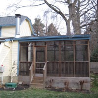 Photo Thumbnail #17: BEFORE: the screened porch that bisects the...