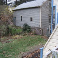 Photo Thumbnail #14: BEFORE: the neighbors garage and a weedy bed