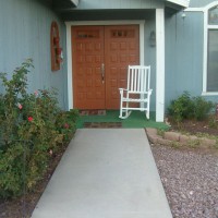 Photo Thumbnail #1: Path leading to front door.  Left of path is...