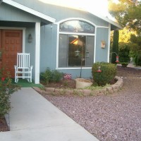 Photo Thumbnail #3: Further out shot of front path, door, and small...