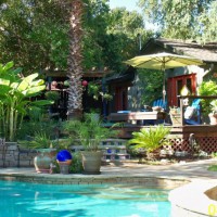 Photo Thumbnail #1: View of the deck from the patio by the pool.