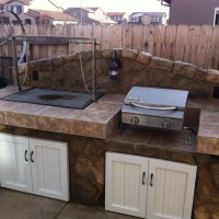 Photo Thumbnail #2: BBQ uses charcoal and wood, table top grill...