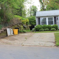 Photo Thumbnail #1: Old cracked concrete driveway, retaining wall...