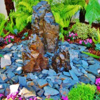 Photo Thumbnail #5: The garden on top features this Basalt fountain