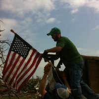 Photo Thumbnail #2: This is our son,Travis, raising the flag at his...