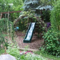 Photo Thumbnail #9: Hobbit hole enterance to the swingset area...