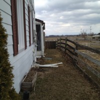 Photo Thumbnail #2: South side of house. We own the field on the...