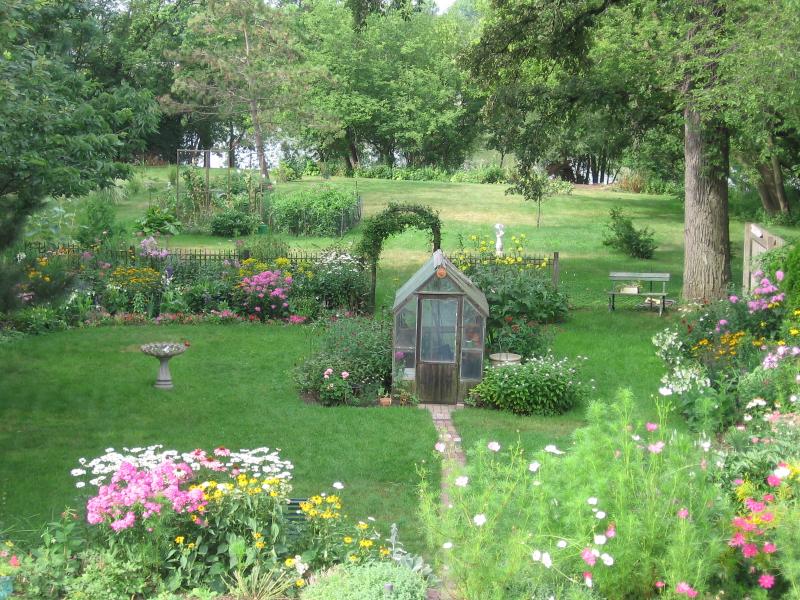 Use a Greenhouse for a Focal Point in Your Garden