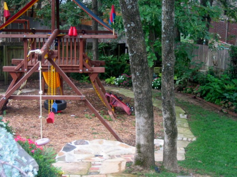 Playset with mulch and a bike track 