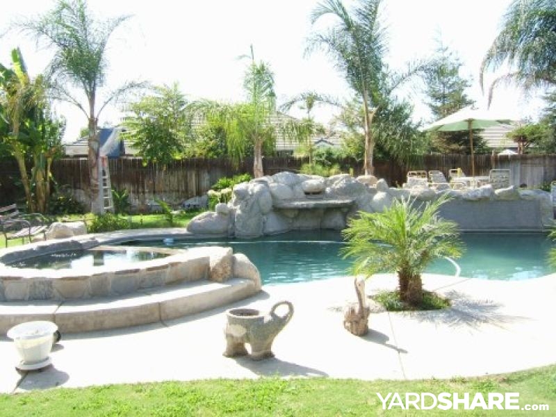 Tropical Back Yard attached rock spa and planting